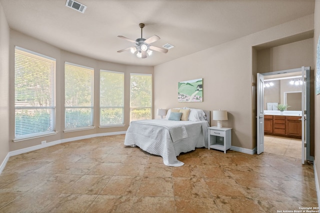bedroom featuring baseboards, a ceiling fan, visible vents, and connected bathroom
