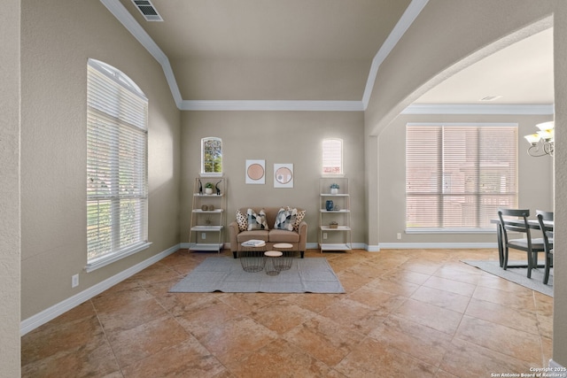 sitting room featuring baseboards, a notable chandelier, ornamental molding, and visible vents