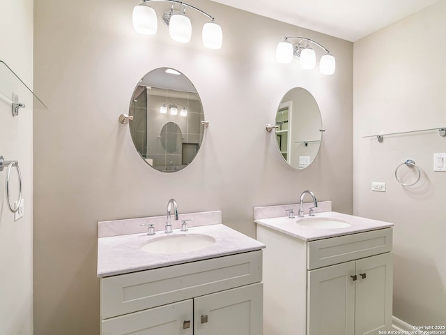 bathroom featuring two vanities and a sink