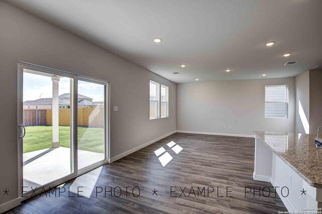 10638 Fairchild Way, San Antonio, TX 78109 - unfurnished living room featuring wood finished floors, baseboards, visible vents, and recessed lighting