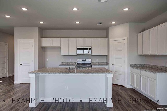 10638 Fairchild Way, San Antonio, TX 78109 - kitchen featuring white cabinetry, light stone counters, and stainless steel appliances