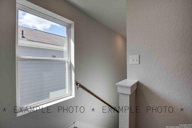 10638 Fairchild Way, San Antonio, TX 78109 - stairway featuring a textured wall