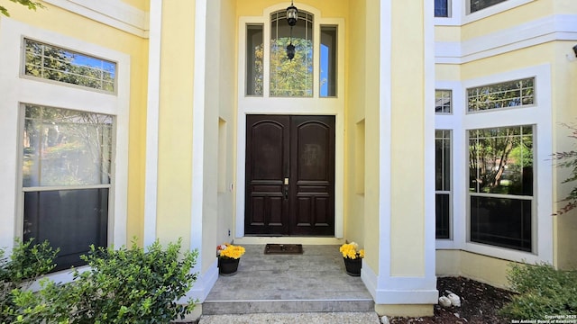 entrance to property with stucco siding