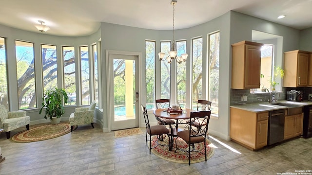dining area featuring recessed lighting, baseboards, and an inviting chandelier