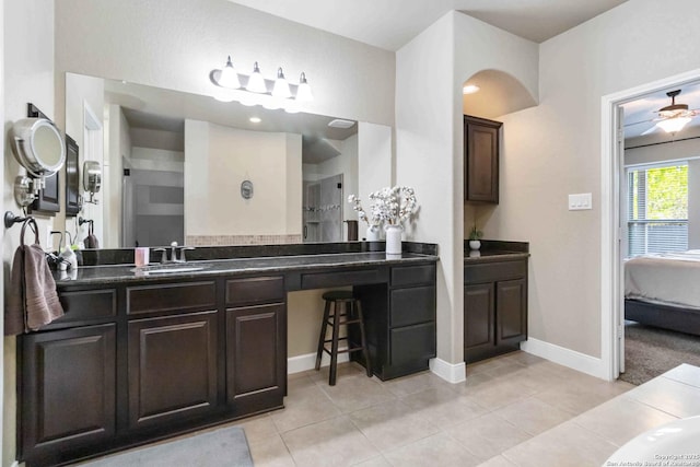 500 Pecan Farms, New Braunfels, TX 78130 - ensuite bathroom featuring tile patterned floors, vanity, baseboards, and connected bathroom