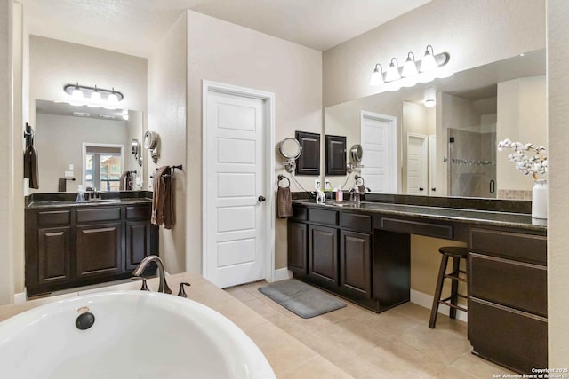 500 Pecan Farms, New Braunfels, TX 78130 - bathroom with a sink, two vanities, a tub, a shower stall, and tile patterned floors