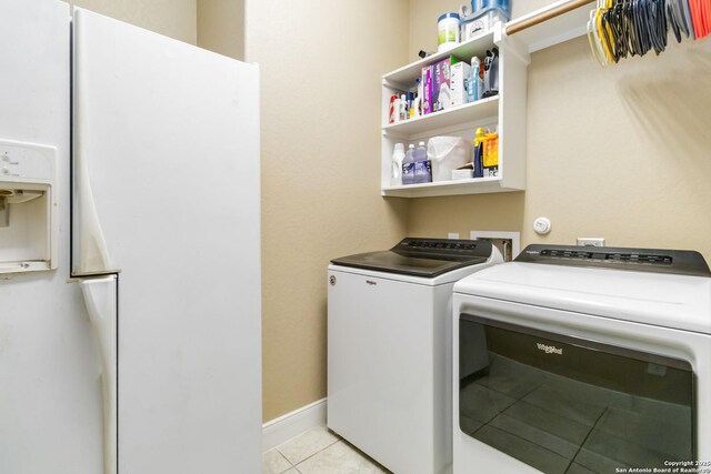 500 Pecan Farms, New Braunfels, TX 78130 - laundry area with laundry area, light tile patterned floors, baseboards, and washing machine and dryer