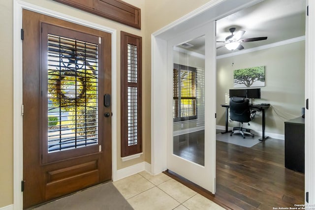 500 Pecan Farms, New Braunfels, TX 78130 - doorway featuring visible vents, baseboards, a ceiling fan, and ornamental molding
