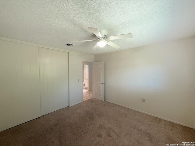 7401 Oak Marsh, Live Oak, TX 78233 - unfurnished bedroom with carpet, visible vents, a closet, and a textured ceiling
