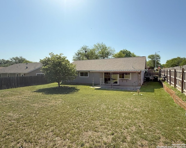 7401 Oak Marsh, Live Oak, TX 78233 - rear view of house with a fenced backyard, a patio, and a lawn