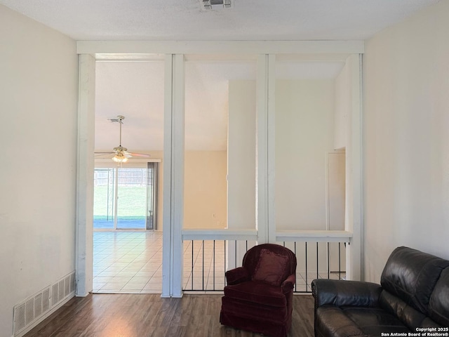 7401 Oak Marsh, Live Oak, TX 78233 - sitting room with visible vents, a ceiling fan, and wood finished floors