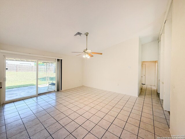 7401 Oak Marsh, Live Oak, TX 78233 - empty room featuring visible vents, light tile patterned flooring, ceiling fan, and lofted ceiling