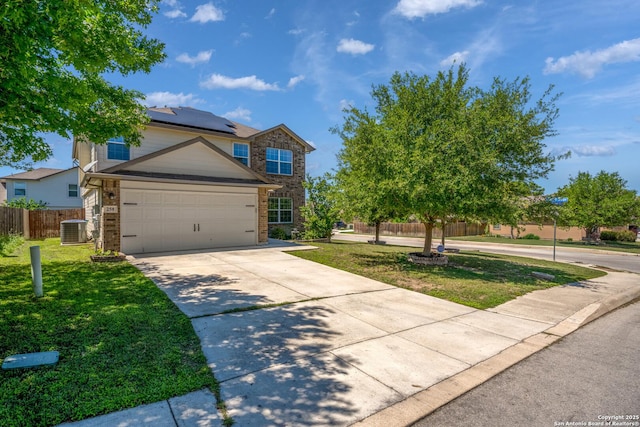 258 Gemsbok Gate, San Antonio, TX 78253 - view of front of house with cooling unit, fence, a front lawn, and roof mounted solar panels