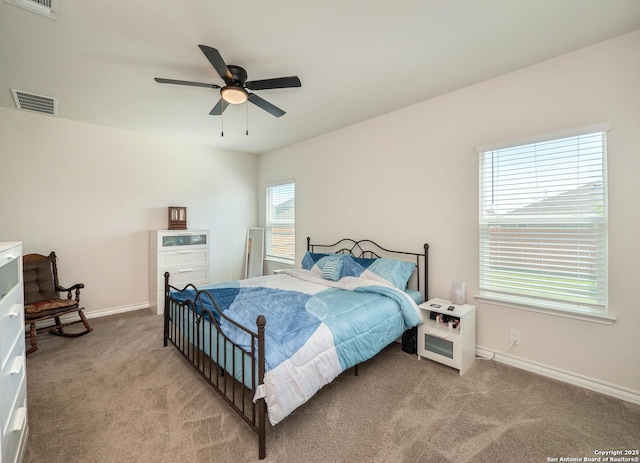 6810 Courante Waltz, San Antonio, TX 78252 - bedroom with ceiling fan, light colored carpet, baseboards, and visible vents