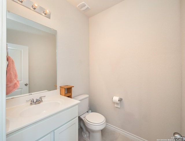 6810 Courante Waltz, San Antonio, TX 78252 - half bathroom featuring vanity, visible vents, toilet, tile patterned floors, and baseboards