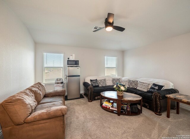 6810 Courante Waltz, San Antonio, TX 78252 - living room featuring visible vents, light colored carpet, and ceiling fan
