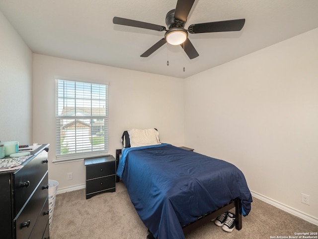 6810 Courante Waltz, San Antonio, TX 78252 - bedroom with light colored carpet, baseboards, and a ceiling fan