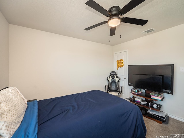 6810 Courante Waltz, San Antonio, TX 78252 - carpeted bedroom featuring visible vents, baseboards, a textured ceiling, and ceiling fan