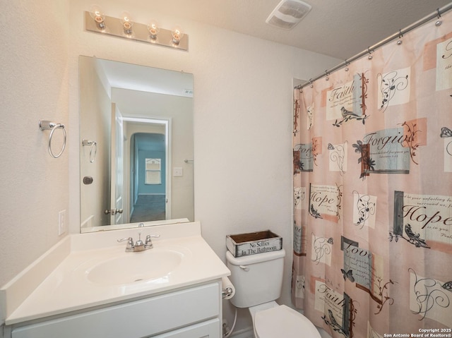6810 Courante Waltz, San Antonio, TX 78252 - full bathroom featuring toilet, curtained shower, vanity, and visible vents