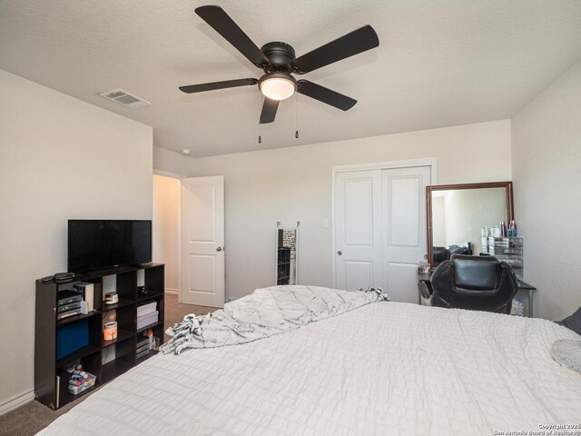 6810 Courante Waltz, San Antonio, TX 78252 - bedroom with a closet, baseboards, carpet flooring, visible vents, and ceiling fan