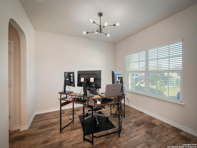 6810 Courante Waltz, San Antonio, TX 78252 - home office with arched walkways, a notable chandelier, baseboards, and dark wood finished floors