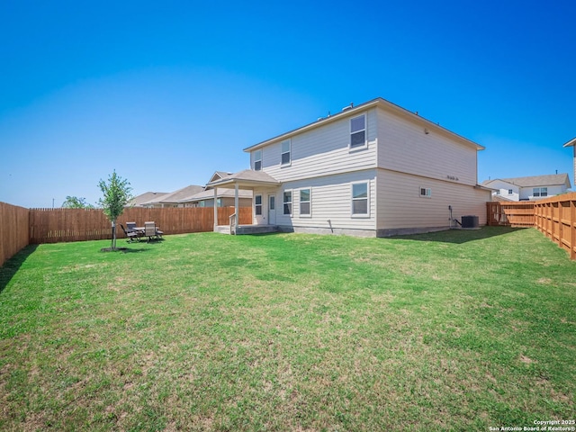 6810 Courante Waltz, San Antonio, TX 78252 - back of property featuring central air condition unit, a yard, and a fenced backyard