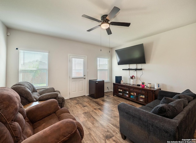 6810 Courante Waltz, San Antonio, TX 78252 - living area featuring wood finished floors, baseboards, and a ceiling fan