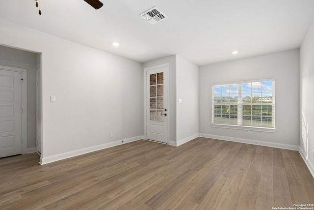 9622 Nubuck Br, Converse, TX 78109 - empty room featuring baseboards, recessed lighting, visible vents, ceiling fan, and wood finished floors