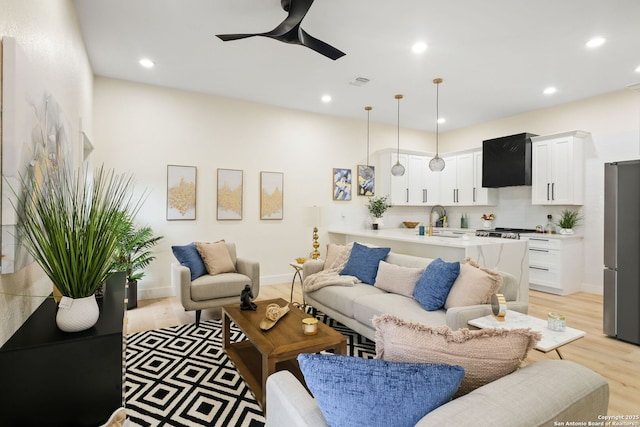 1019 S Hackberry, San Antonio, TX 78210 - living room featuring light wood-style floors, ceiling fan, visible vents, and recessed lighting