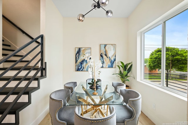 1019 S Hackberry, San Antonio, TX 78210 - dining area with baseboards, stairway, a notable chandelier, and wood finished floors