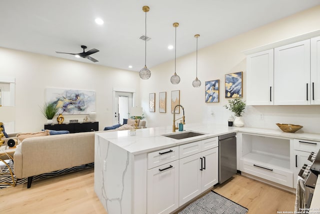 1019 S Hackberry, San Antonio, TX 78210 - kitchen with open floor plan, a peninsula, a sink, and appliances with stainless steel finishes