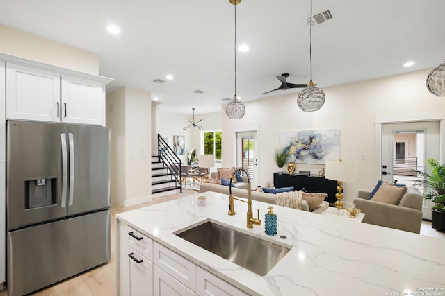 1019 S Hackberry, San Antonio, TX 78210 - kitchen featuring open floor plan, a sink, visible vents, and stainless steel refrigerator with ice dispenser
