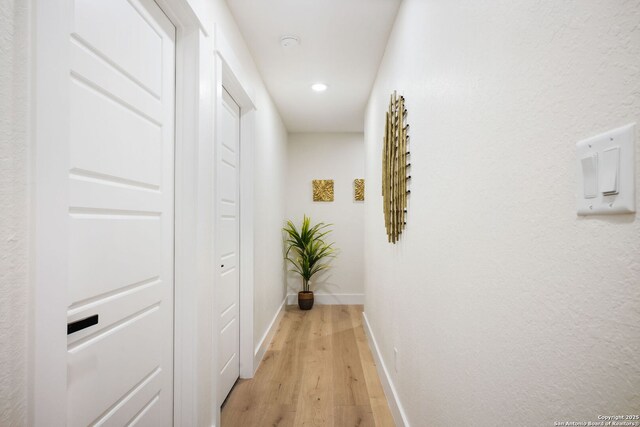 1019 S Hackberry, San Antonio, TX 78210 - hall with light wood finished floors, baseboards, and recessed lighting