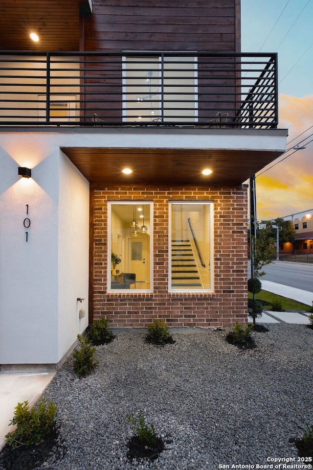 1019 S Hackberry, San Antonio, TX 78210 - entrance to property with brick siding, stucco siding, and a balcony
