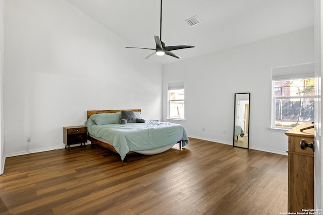 9311 Longmire, San Antonio, TX 78245 - bedroom featuring dark wood-style flooring, baseboards, a ceiling fan, and high vaulted ceiling