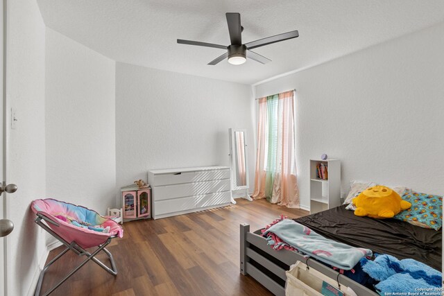 9311 Longmire, San Antonio, TX 78245 - bedroom with wood finished floors and ceiling fan