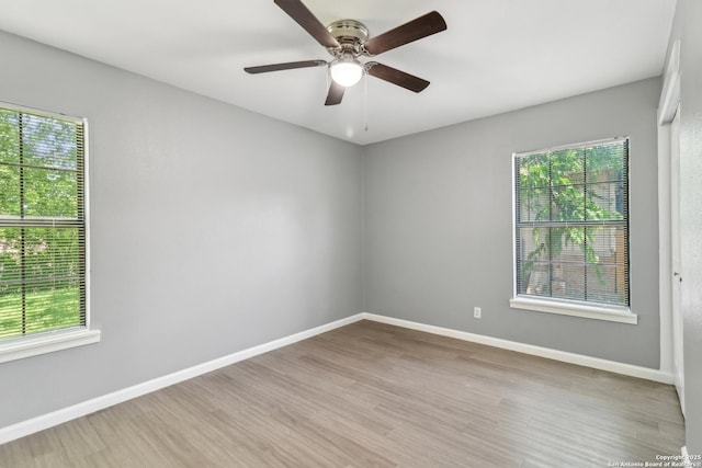2415 Spicewood, San Antonio, TX 78213 - unfurnished room with wood finished floors, plenty of natural light, and baseboards