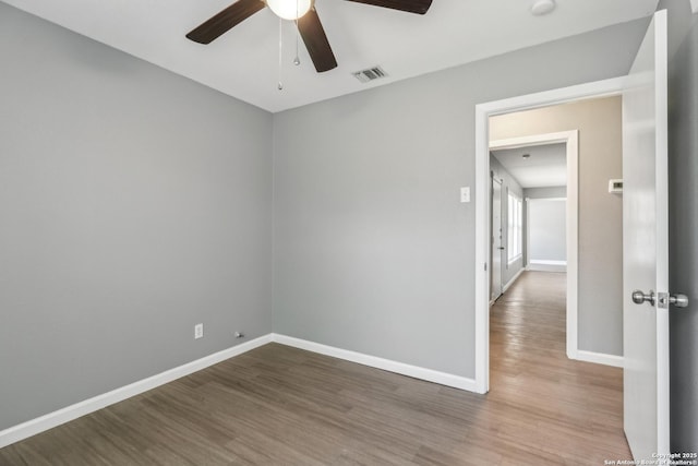 2415 Spicewood, San Antonio, TX 78213 - spare room featuring a ceiling fan, wood finished floors, and baseboards