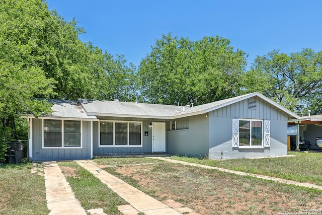 2415 Spicewood, San Antonio, TX 78213 - single story home with board and batten siding, brick siding, a front yard, and a shingled roof