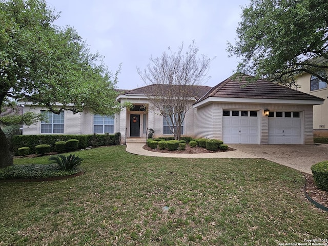 ranch-style home featuring a front lawn and driveway