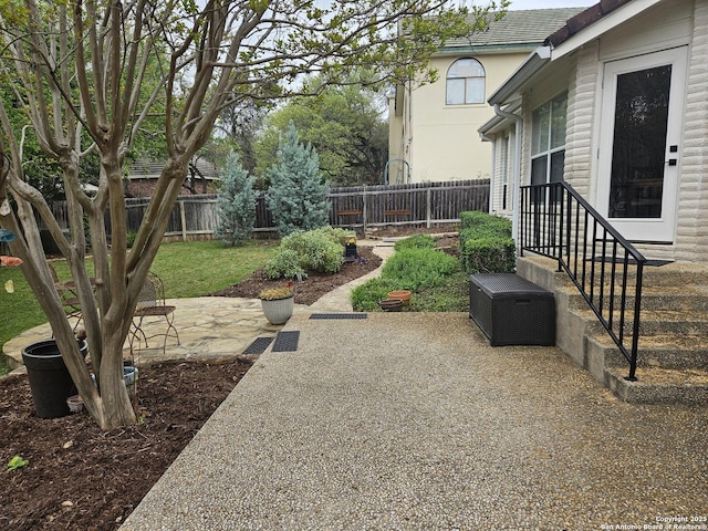 view of yard featuring a patio area and a fenced backyard