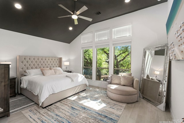 bedroom with light wood-type flooring, visible vents, recessed lighting, a ceiling fan, and high vaulted ceiling
