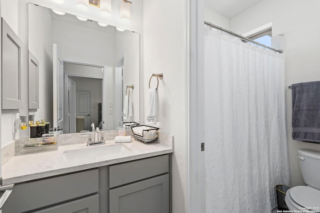full bath featuring toilet and vanity