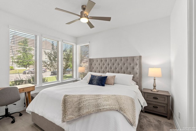bedroom featuring baseboards and a ceiling fan