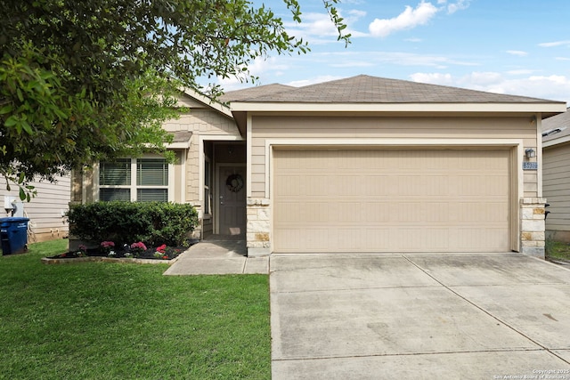 ranch-style house featuring an attached garage, driveway, a front yard, and stone siding