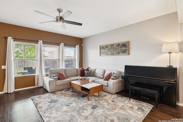 living area featuring wood-type flooring and ceiling fan
