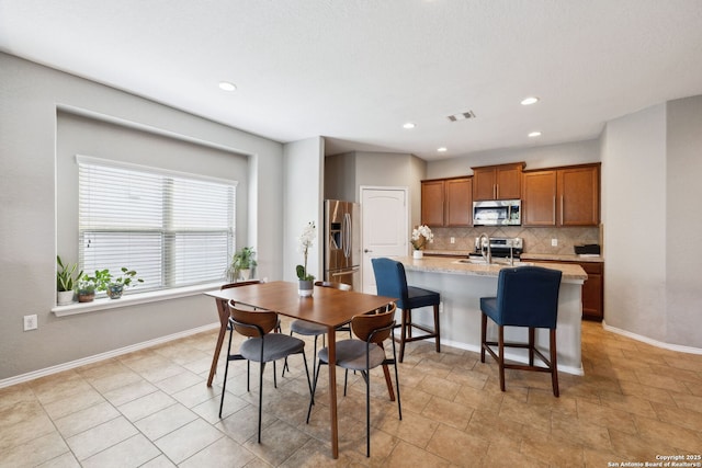 dining area featuring visible vents, baseboards, and recessed lighting