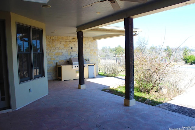 1844 Reeh Rd, Fredericksburg, TX 78624 - view of patio featuring ceiling fan, area for grilling, and an outdoor kitchen