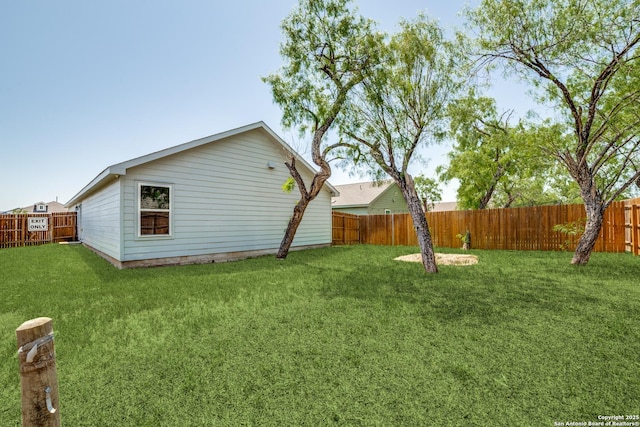 view of yard with a fenced backyard