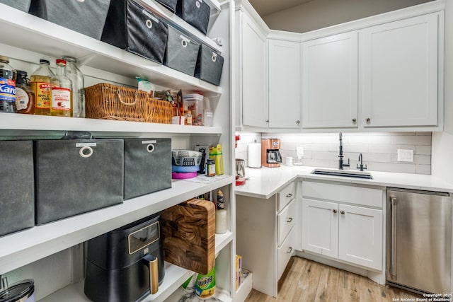 storage area featuring a sink